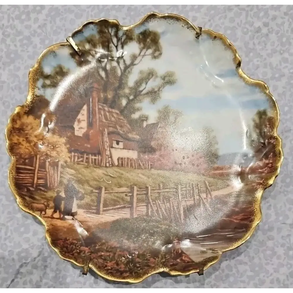 Decorative plate with a scenic village design