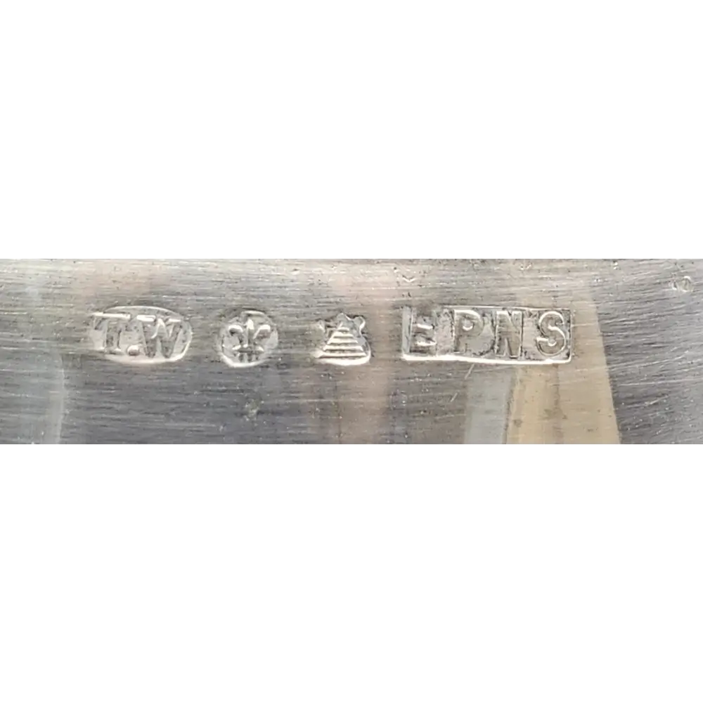 Close-up of a metal blade with engraved text