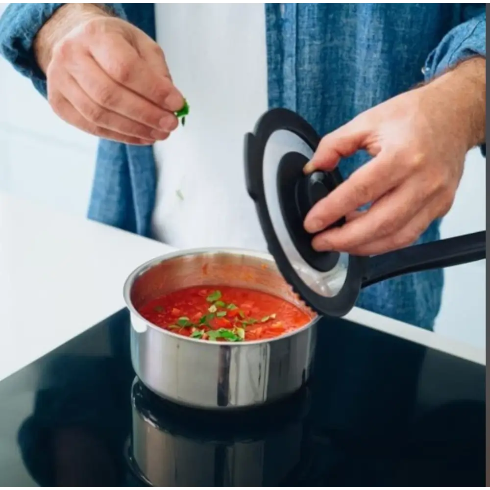 Person adding ingredients to a pot
