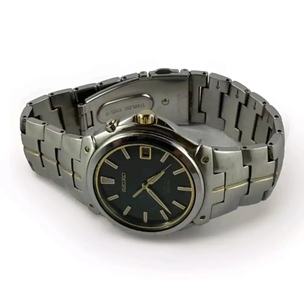 Silver watch with black face on a white background