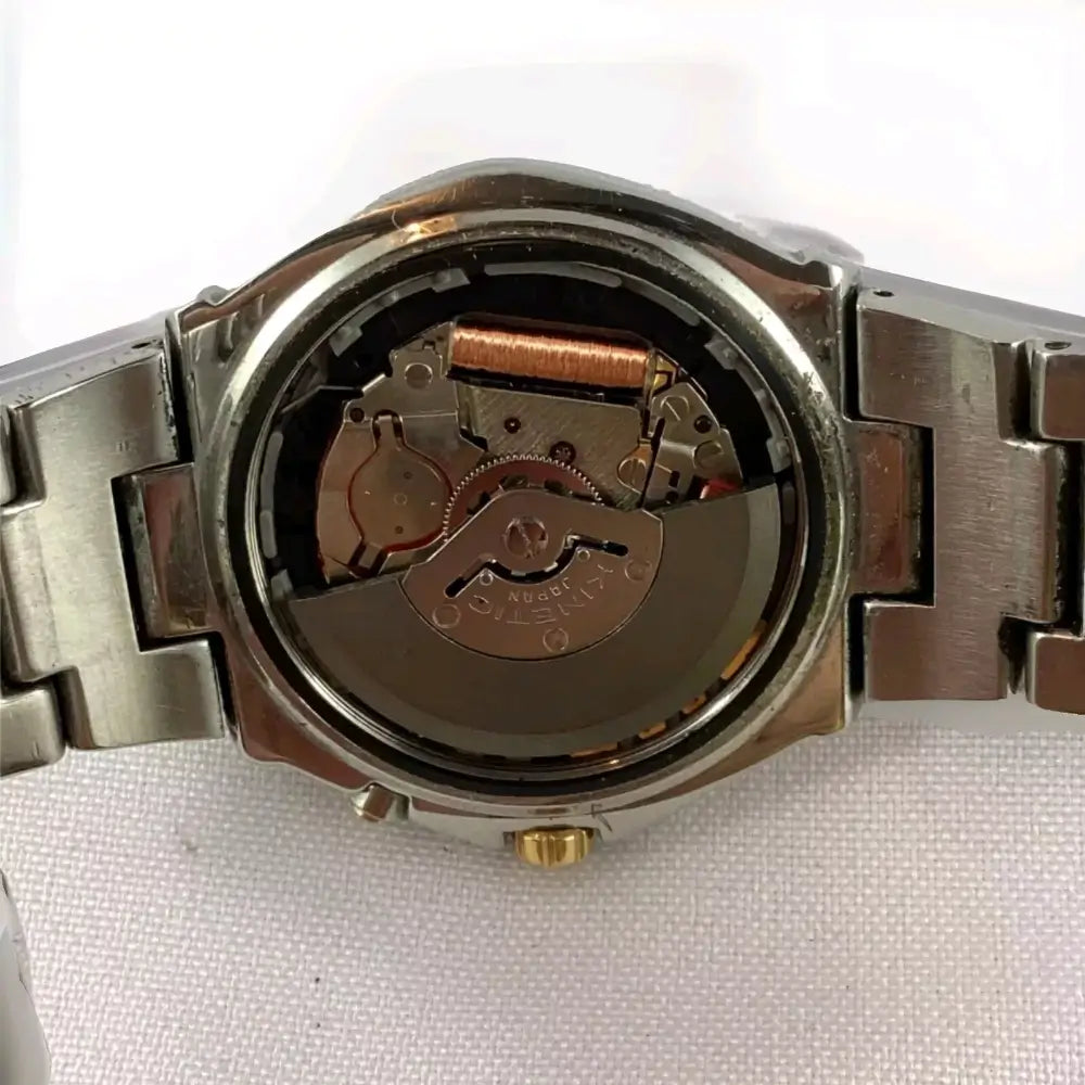Watch mechanism exposed on a white background