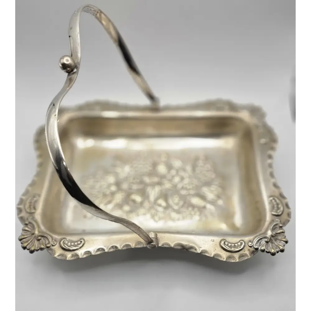 Silver basket with decorative handle