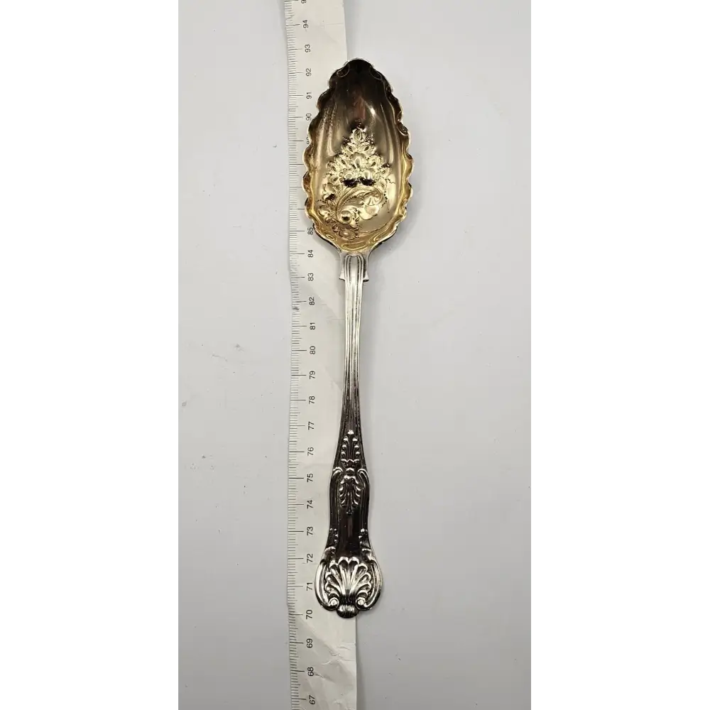 Decorative silver spoon with gold leaf design