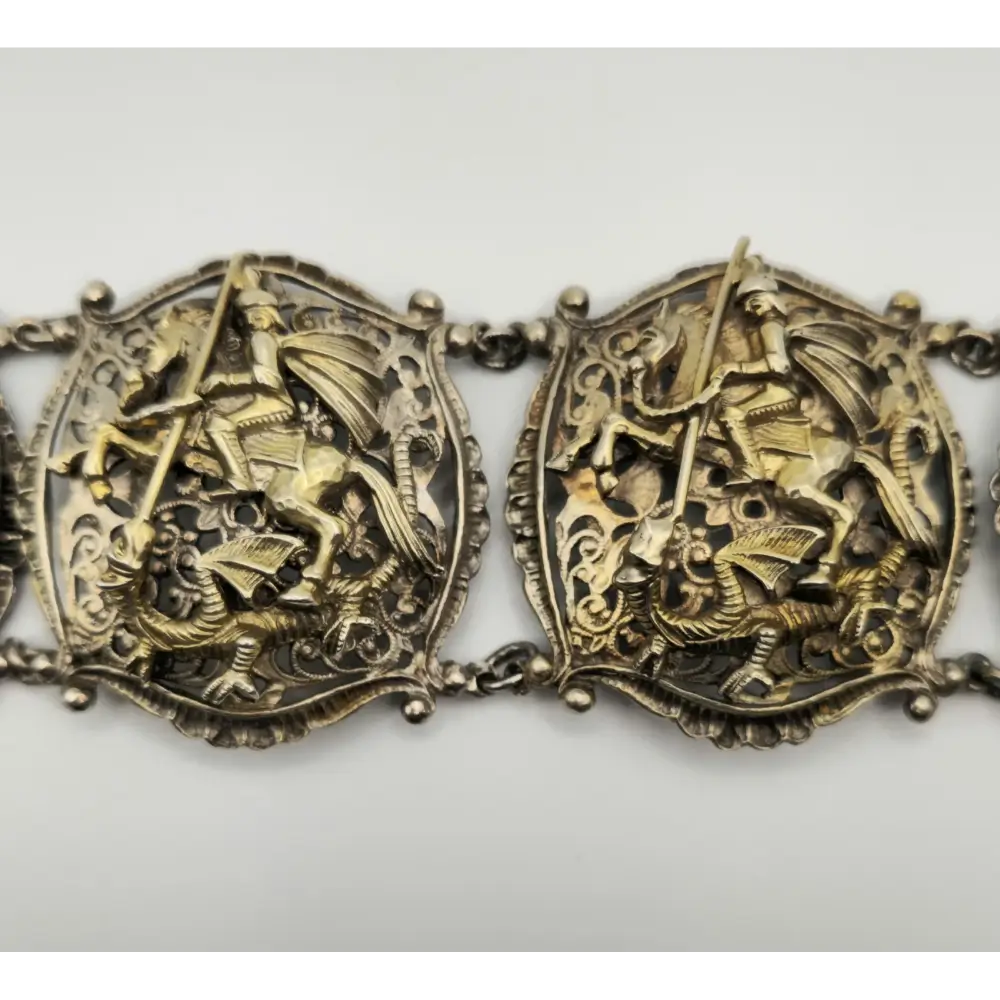 Decorative Silver Bracelet with intricate designs on a white background