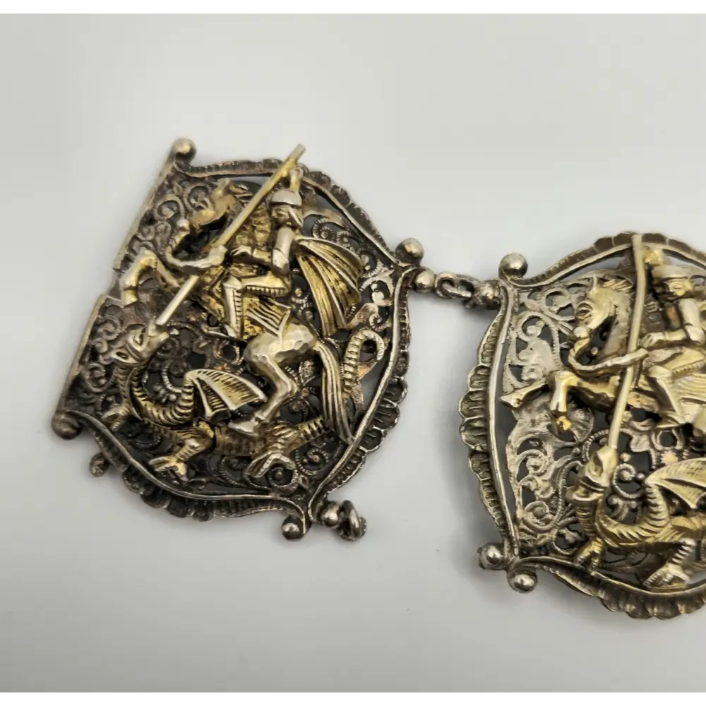 Decorative Silver Bracelet with intricate designs on a light gray background