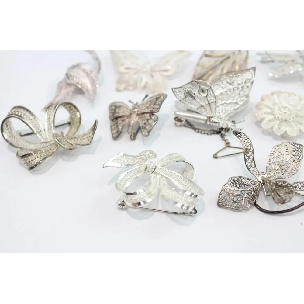 Collection of silver Brooches including bows and butterflies
