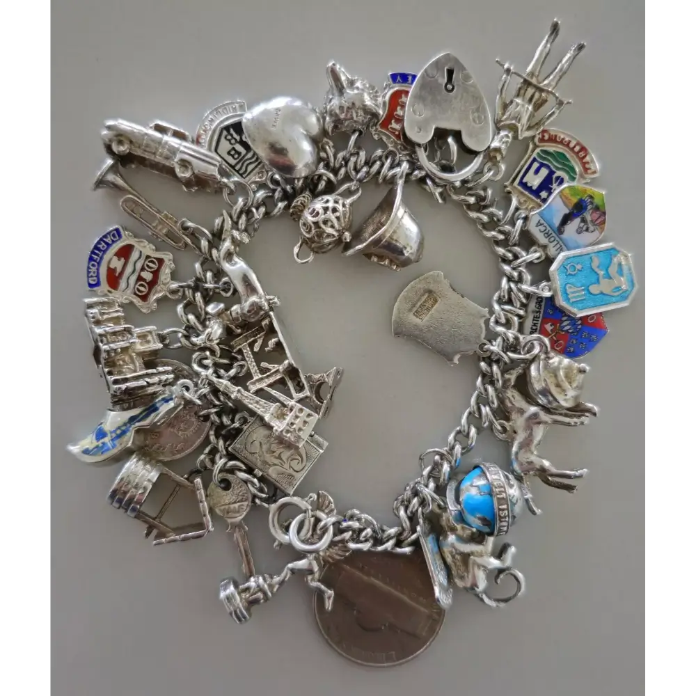 Silver charm bracelet with various charms