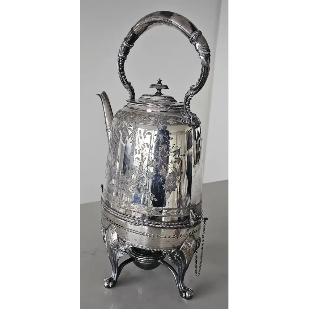 Silver teapot with intricate designs