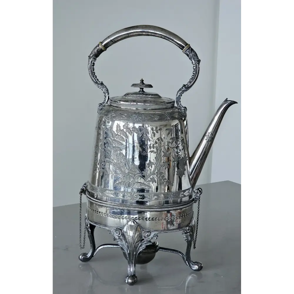 Silver teapot with decorative patterns