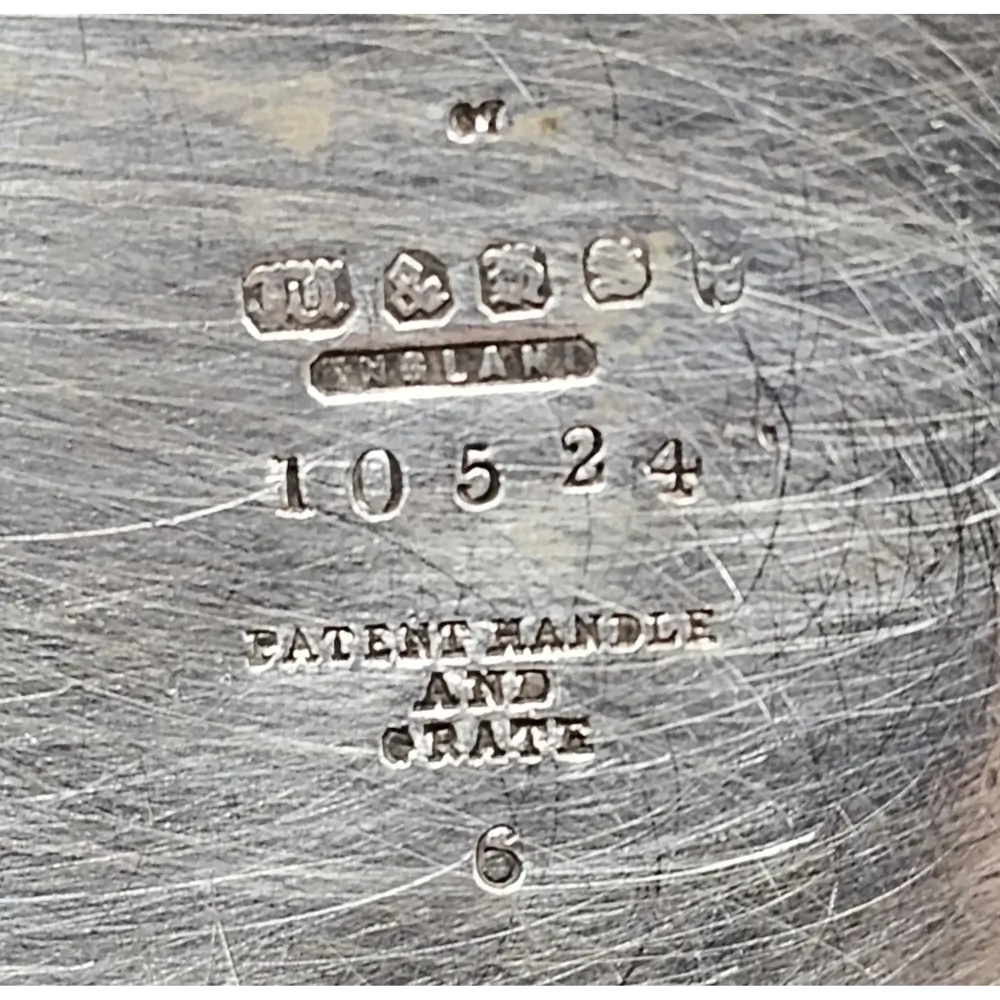 Close-up of a metal object with engraved text and numbers
