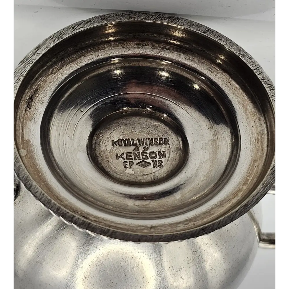 Close-up of a metallic bowl with 'Royal Windsor' branding
