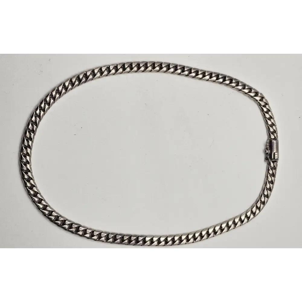 Silver chain necklace on a white background