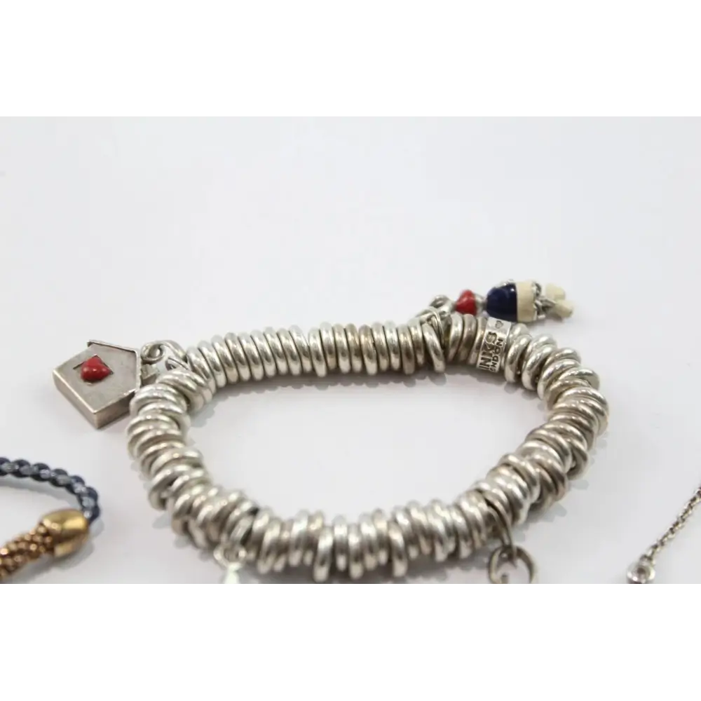 Silver bracelet with various charms
