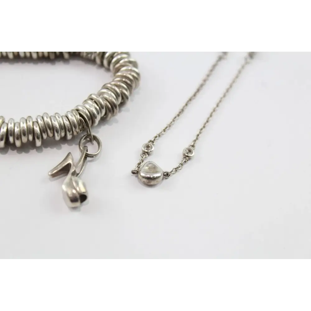 Silver bracelet and necklace with heart charm