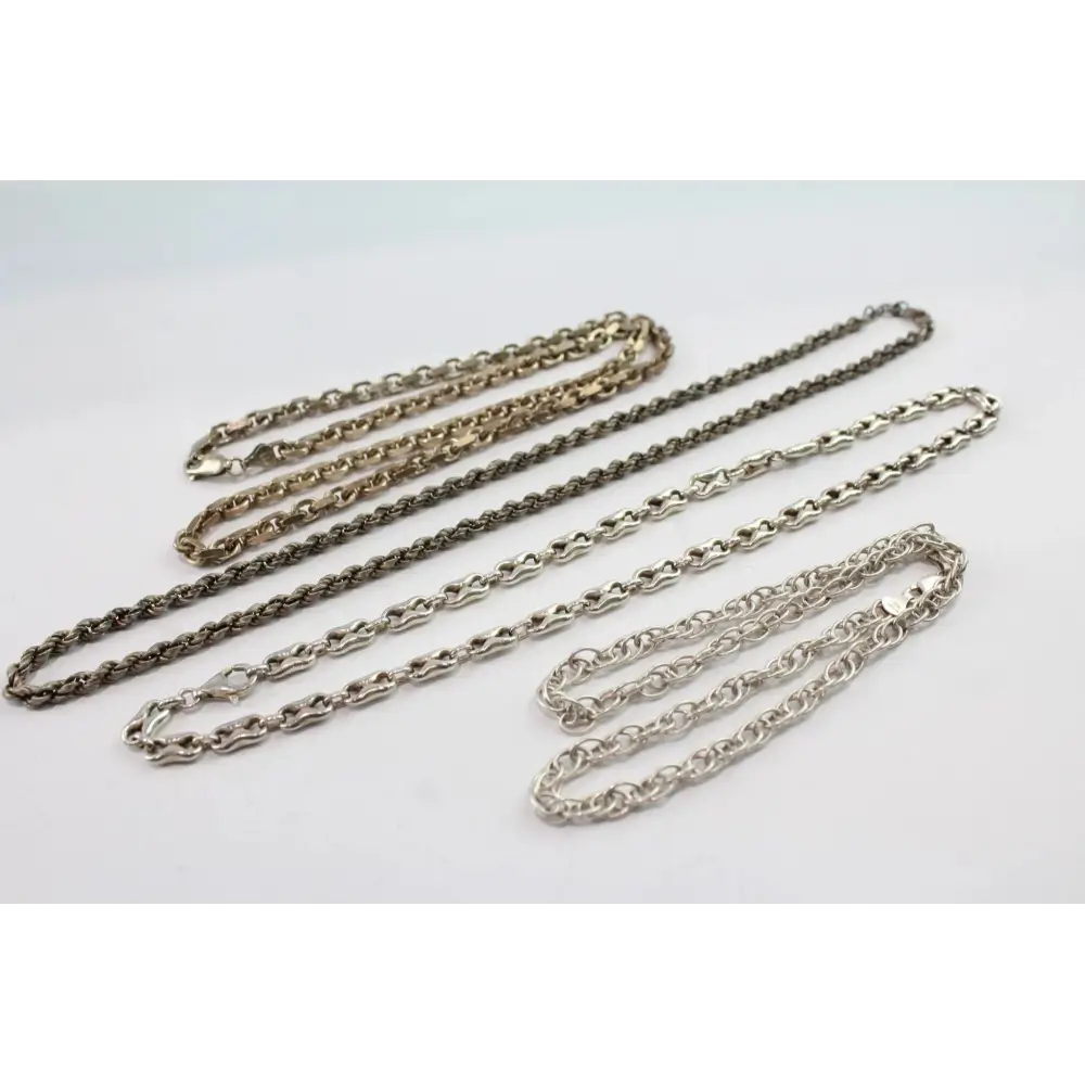 Three silver chains of different lengths
