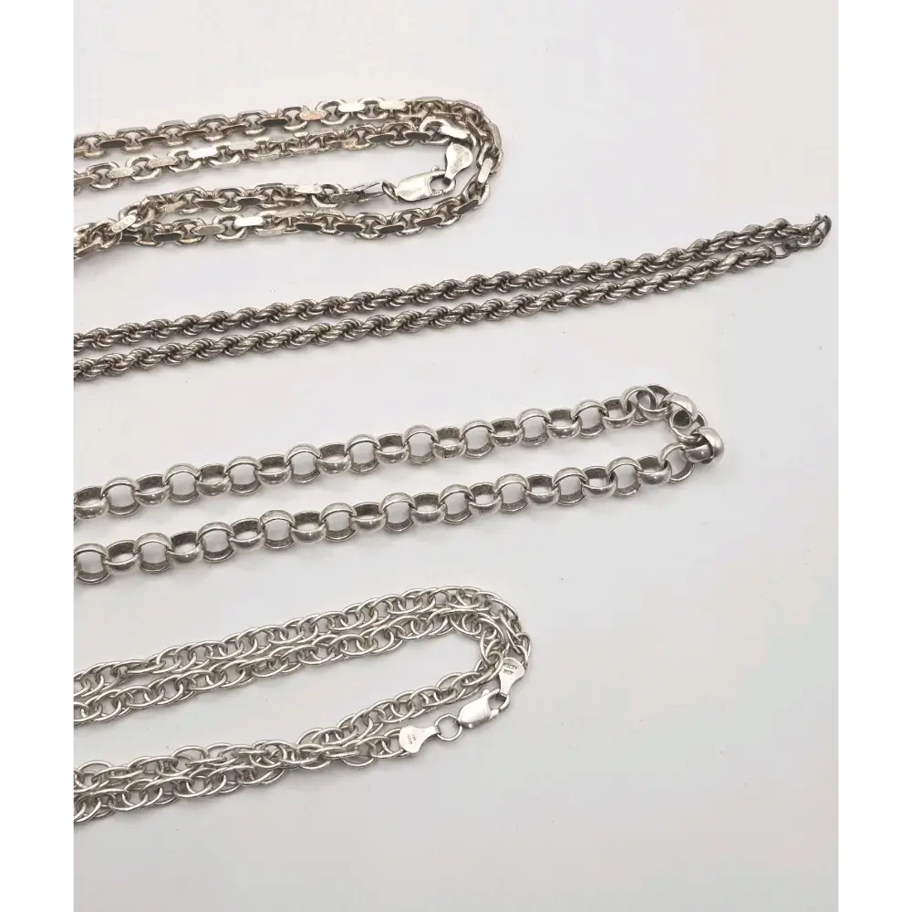 Four silver chains of different designs