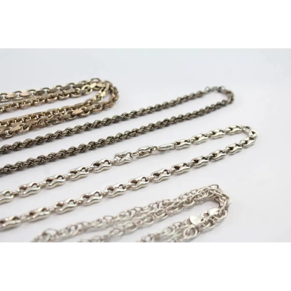 Four different chains on a light gray background
