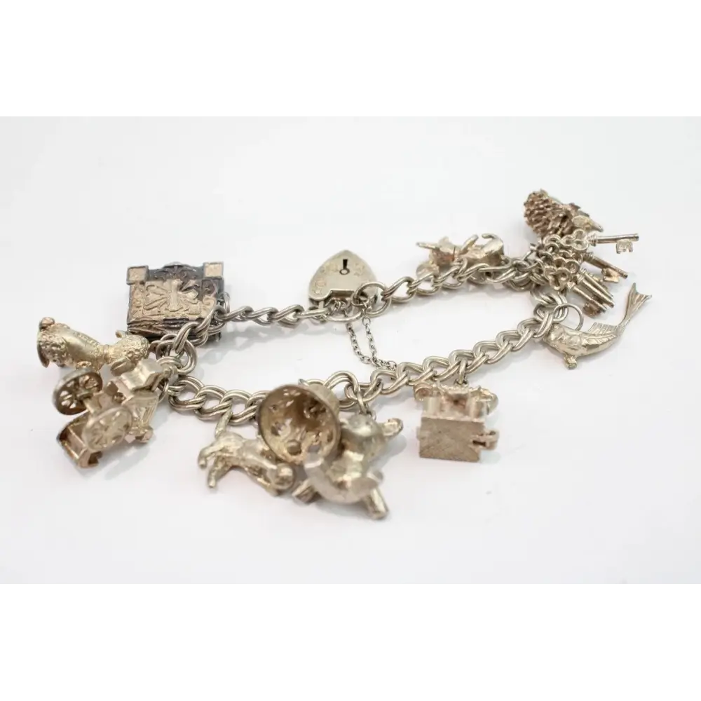 Silver charm bracelet with various charms
