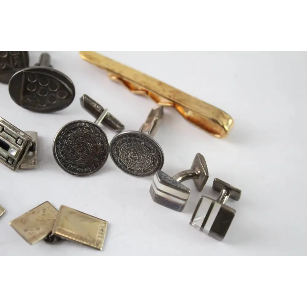 Collection of vintage cufflinks and tie pins