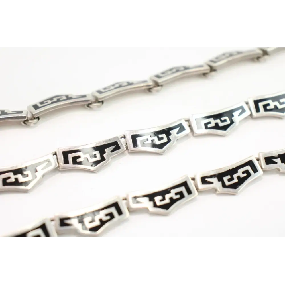 Silver chain with geometric black designs