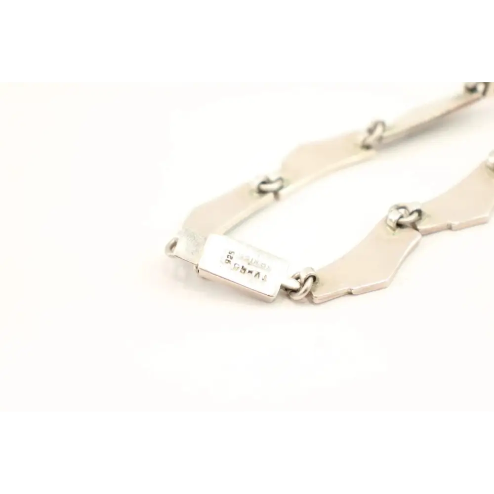 Gold bracelet with a tag