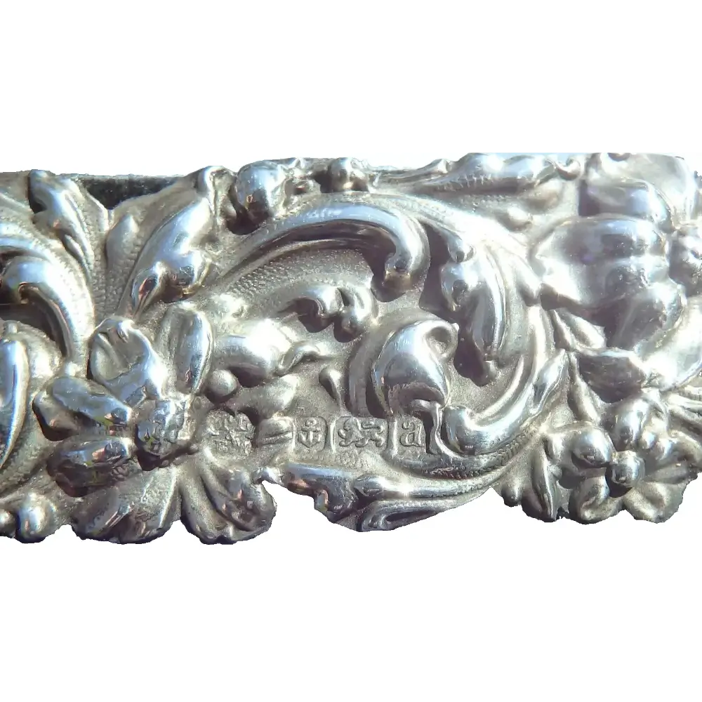 Decorative silver bar with intricate patterns