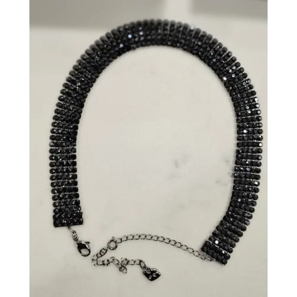 Black beaded necklace on a white background