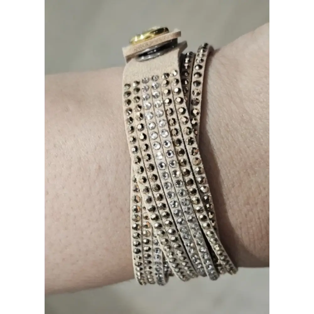 Beige leather bracelet with rhinestone detailing