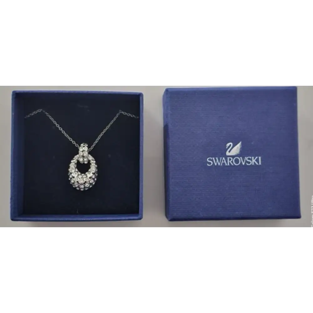 Swarovski necklace in a blue box with the Swarovski logo.