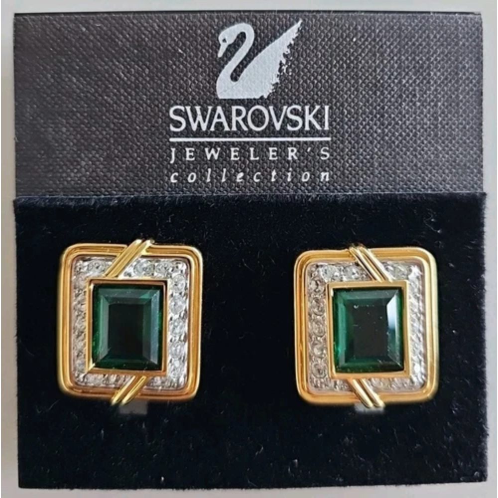 Swarovski earrings with green gemstones on a branded card