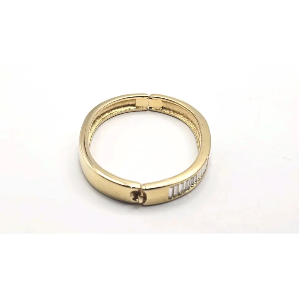 Gold Bangle with engraved text on a white background