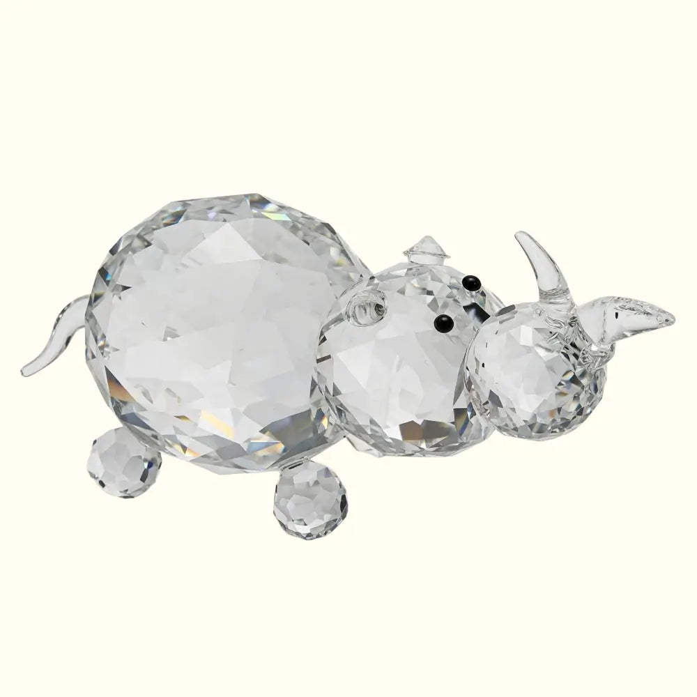 Crystal rhinoceros figurine on a white background