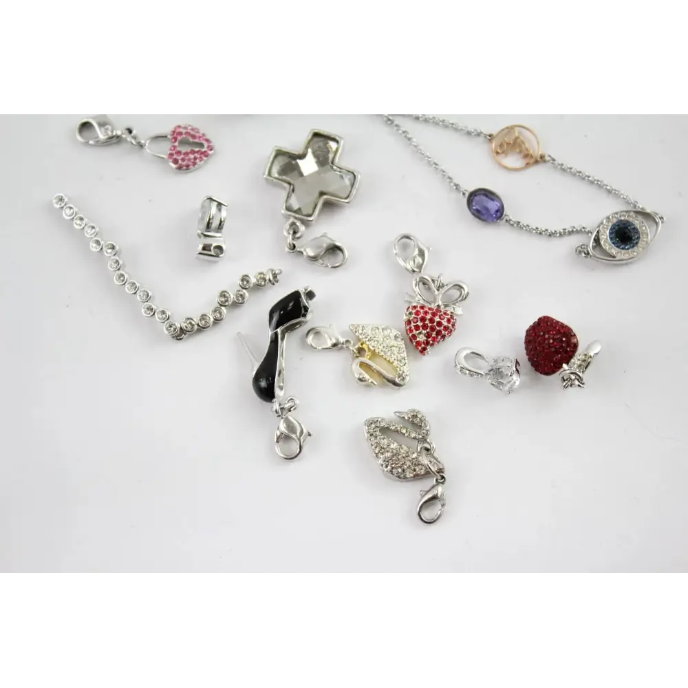 Collection of various jewelry pendants on a white background