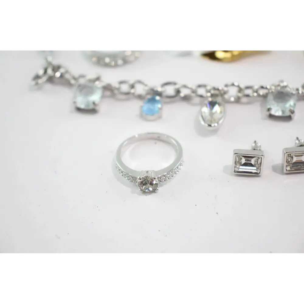 Silver jewelry including a bracelet, ring, and earrings