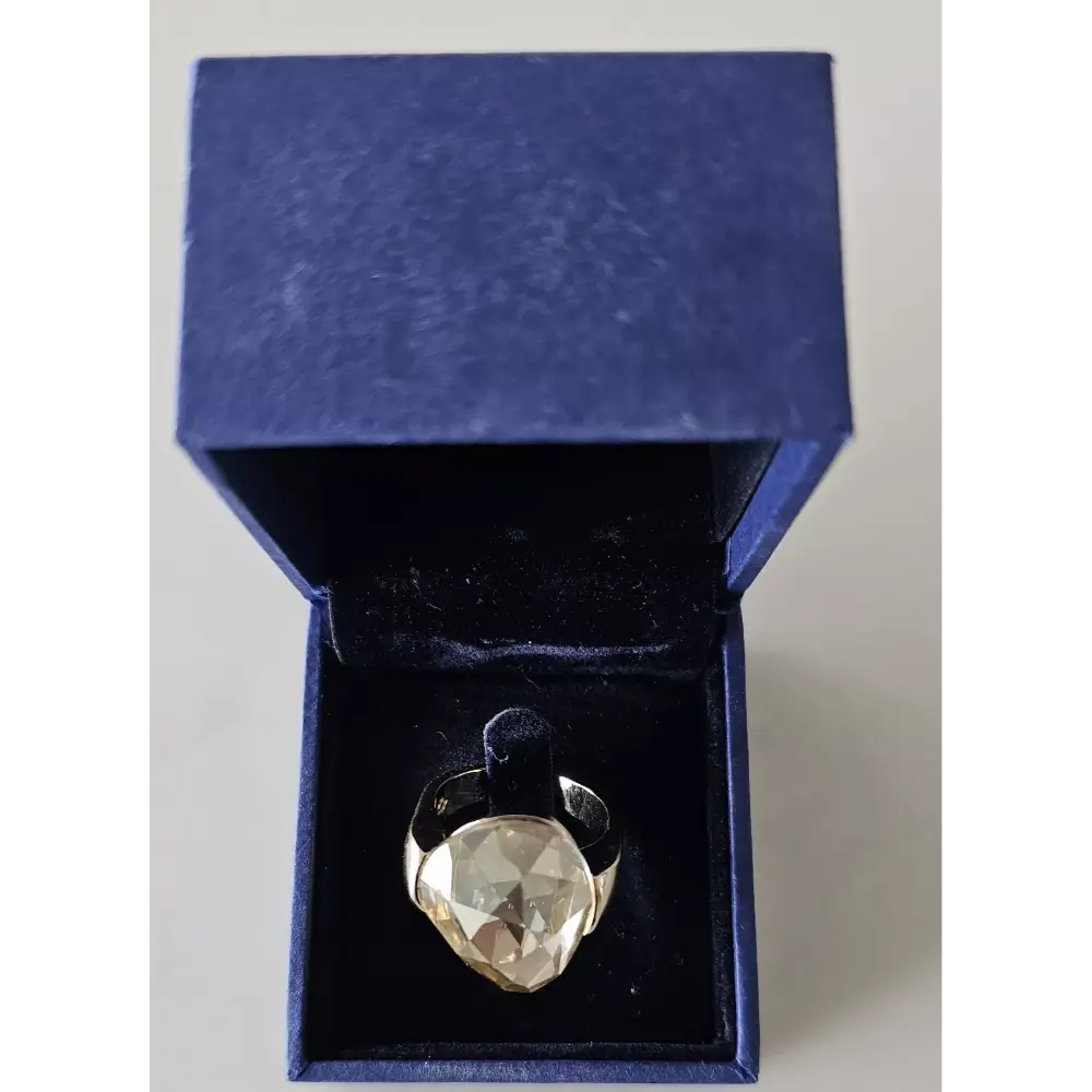 Heart-shaped ring with a large diamond in a blue box