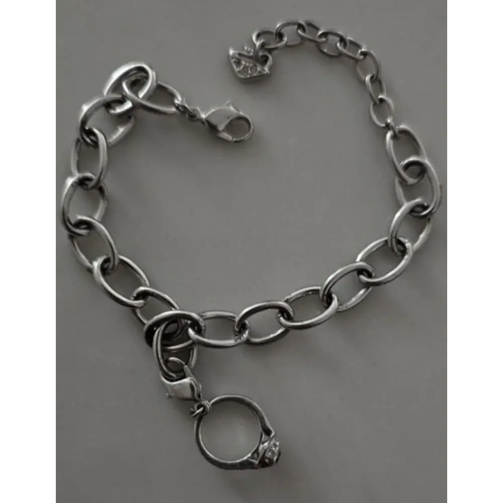 Silver chain bracelet with a ring charm