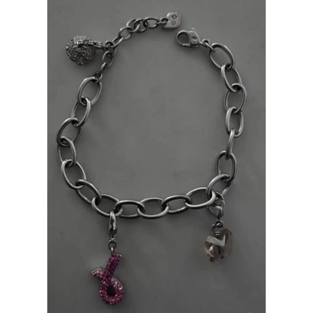 Silver chain bracelet with charms on a gray background
