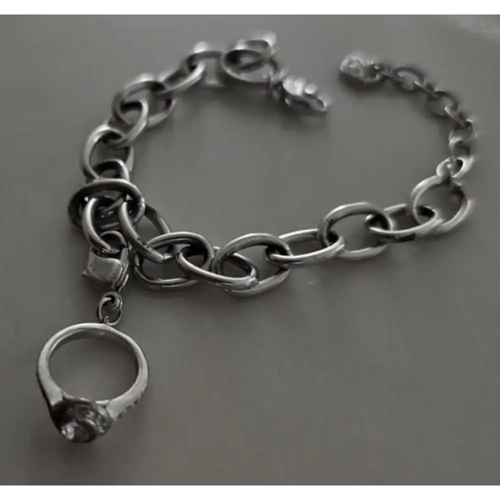 Silver chain bracelet with a ring charm