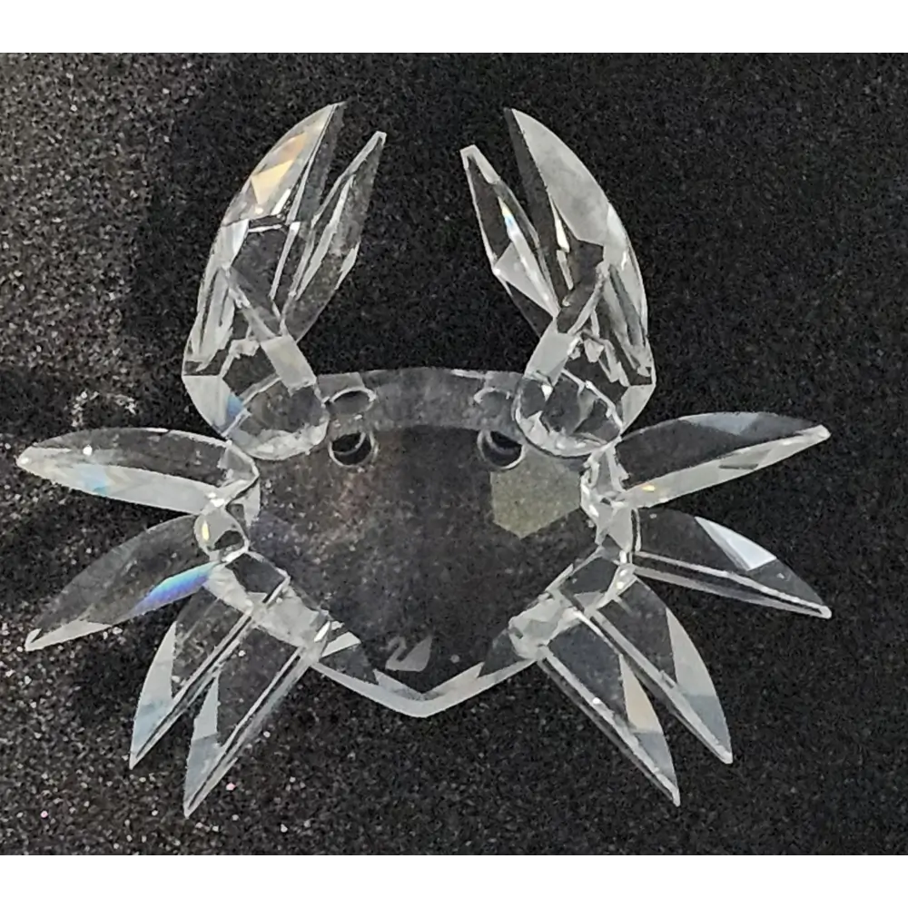 Clear crystal crab ornament on a black background