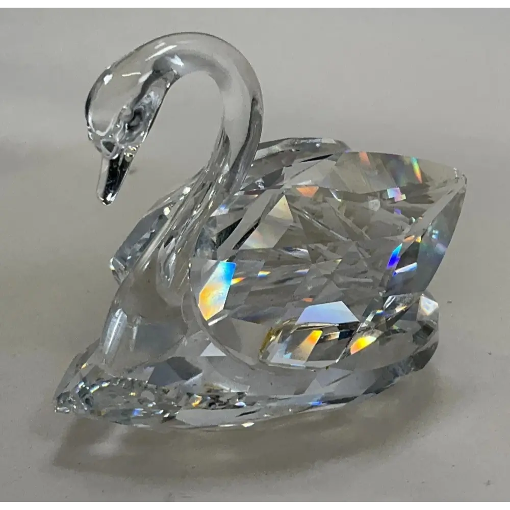 Large Swarovski crystal swan with three small swans