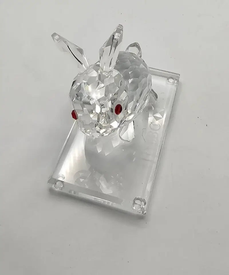 Crystal deer figurine on a clear stand