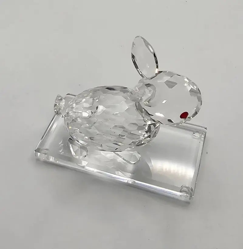Clear crystal rabbit figurine on a white background