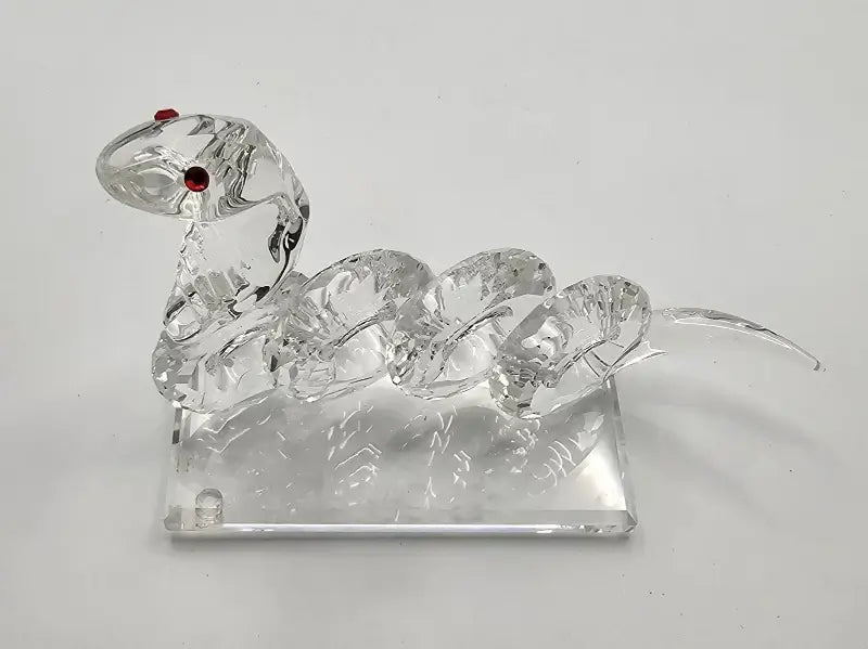 Clear glass swan ornament on a white background