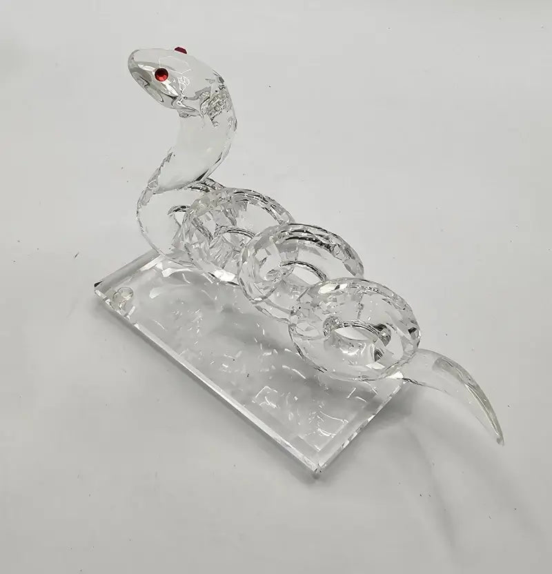 Crystal snake figurine on a white background