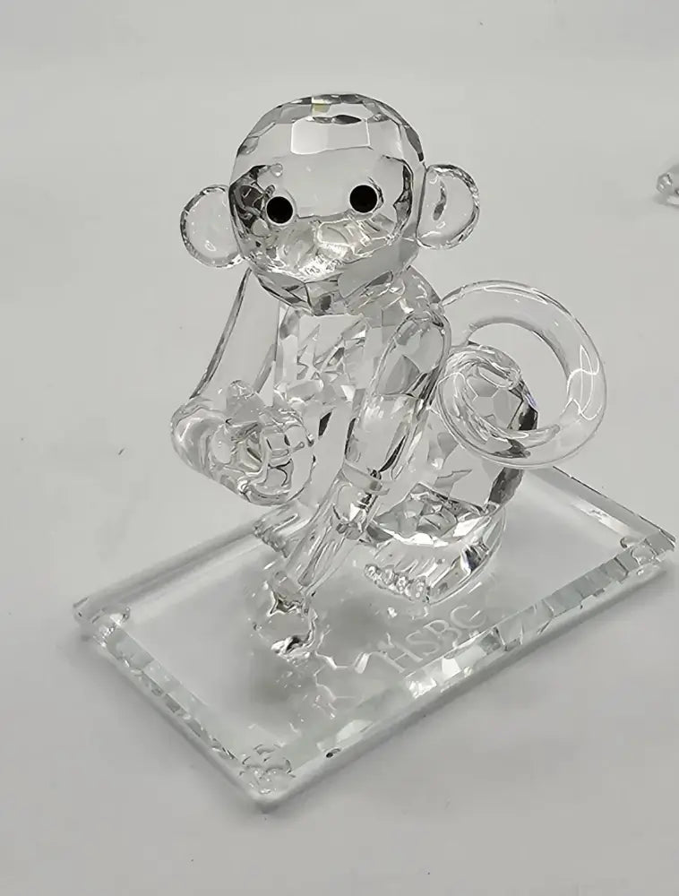 Crystal monkey figurine on a clear base