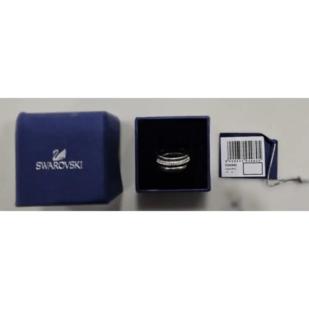 Swarovski ring in packaging with a blue Swarovski pouch and box on a white background.