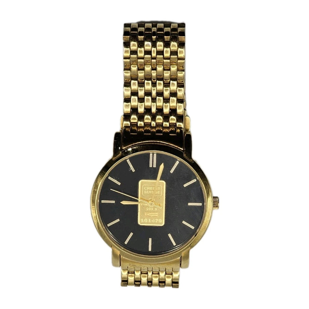 Gold watch with black face on a white background