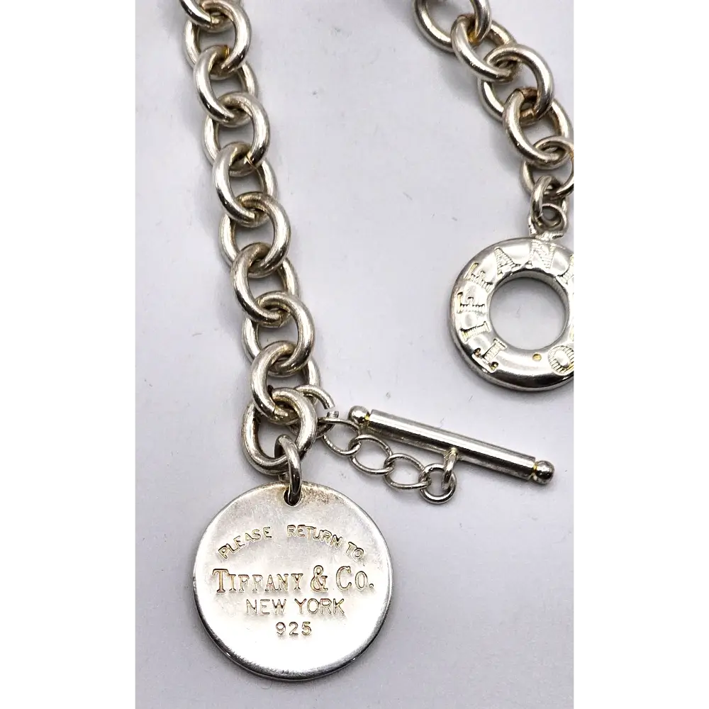 Silver chain bracelet with a tag featuring Tiffany & Co. branding