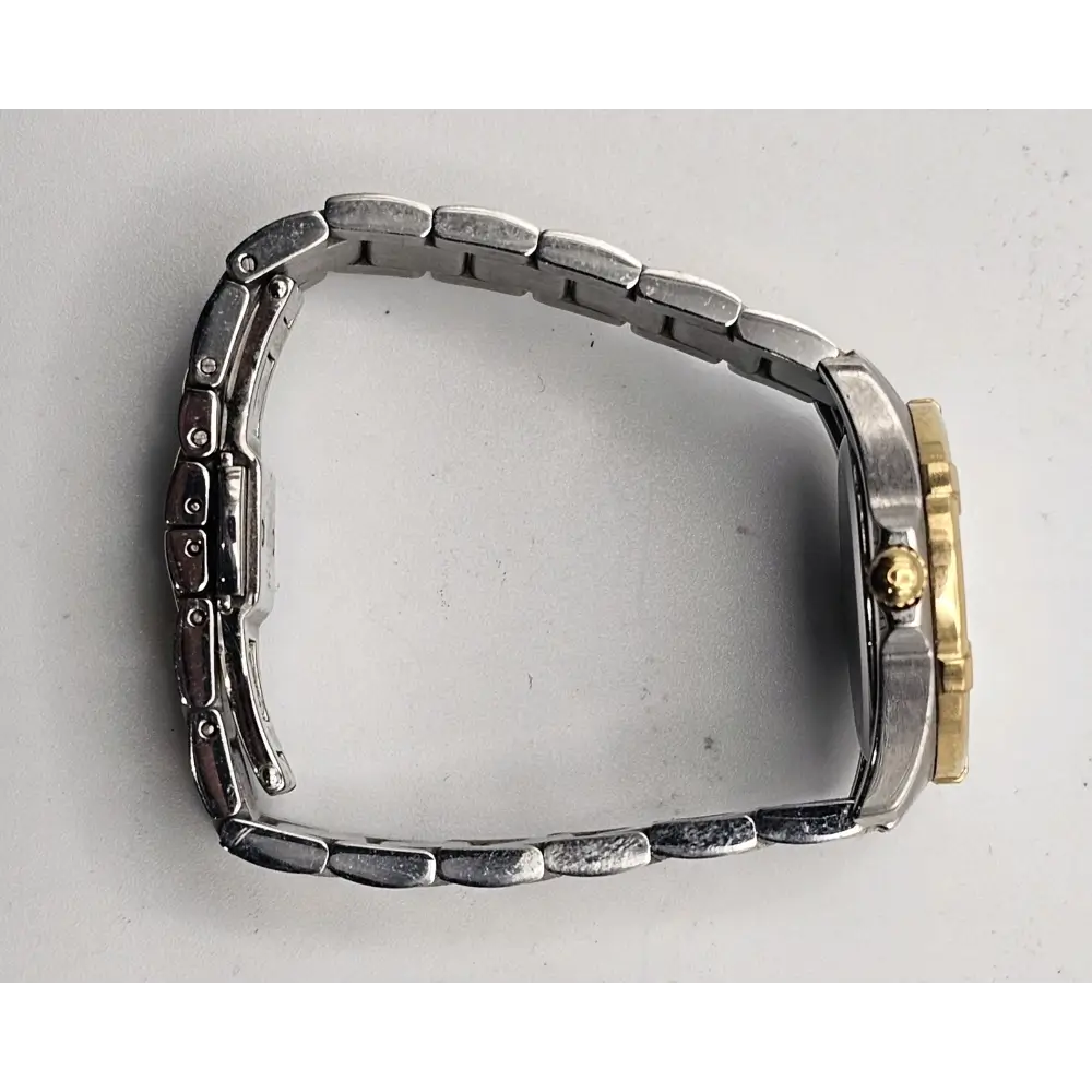 Metallic watch case with gold and silver accents