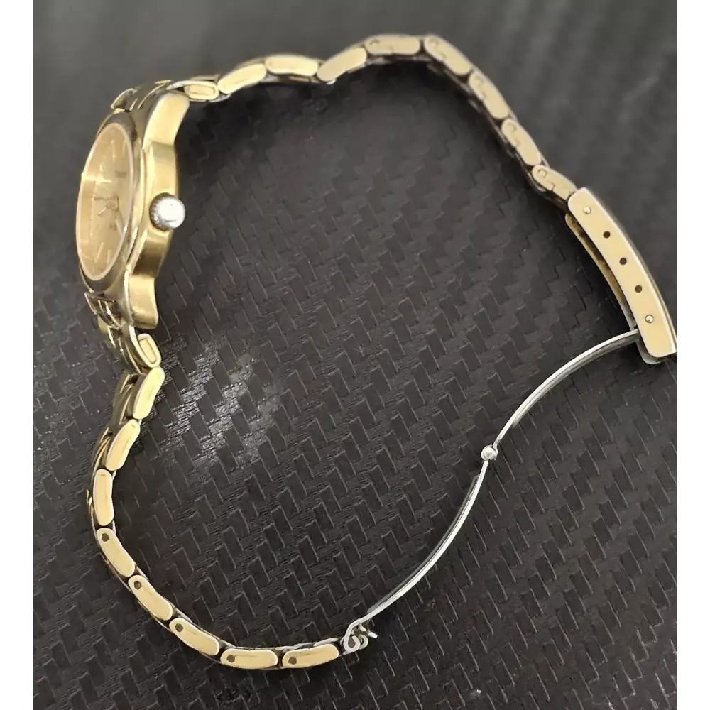 Gold watch with a textured band